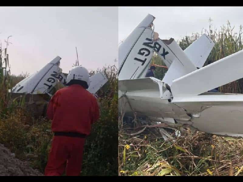 Elementos de emergencia del Estado de México llevan a cabo labores de auxilio donde cayó la aeronave en el municipio de Otzolotepec