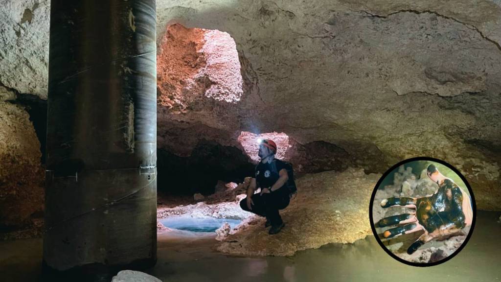 Ambientalista observa la perforación de una cueva por obras del Tren Maya.