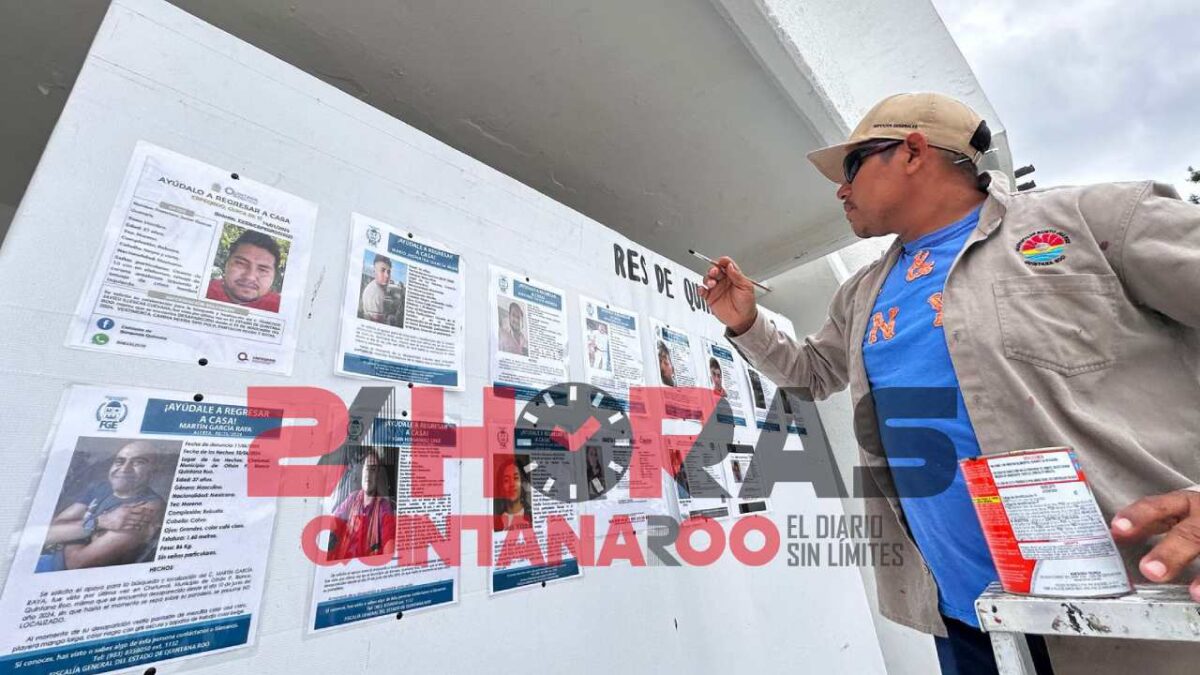 Muro de fichas de personas desaparecidas en Quintana Roo.