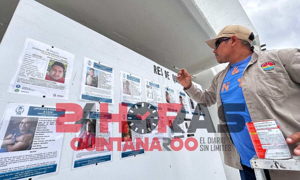 Muro de fichas de personas desaparecidas en Quintana Roo.